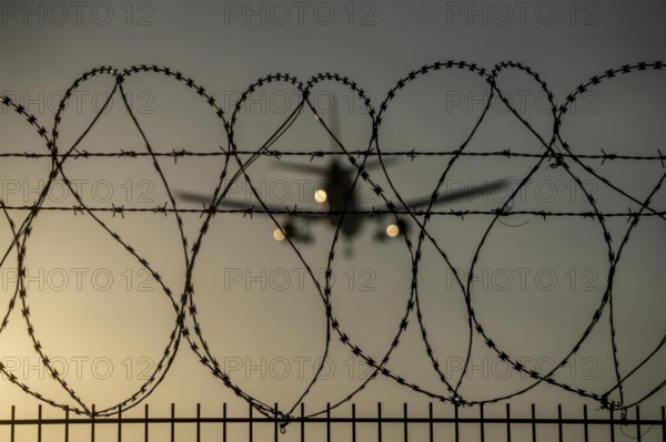Symbolic image security at the airport, outer fence at Düsseldorf International Airport, steel wire