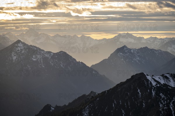 Mountain panorama with snow at sunset, in autumn, view from Kramerspitz, Bavarian Prealps, Bavaria,