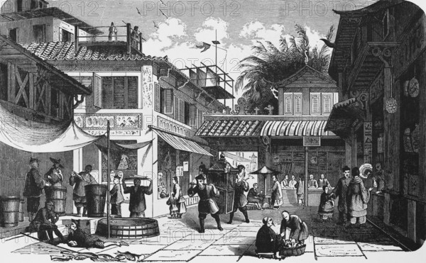 Business street in the city centre of Canton or Guangzhou, shops, trade, people carrying, paved