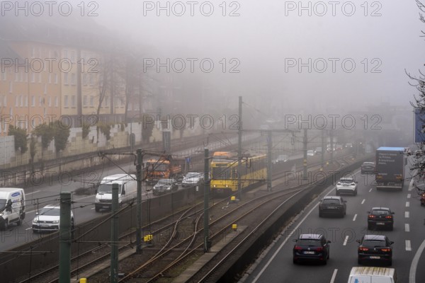 Dense fog, with visibility sometimes less than 100 metres, A40 motorway, city passage in Essen,