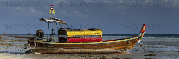 Longtail boat on the beach, at low tide, Koh Ngai Island, Andaman Sea, Satun Province, Southern