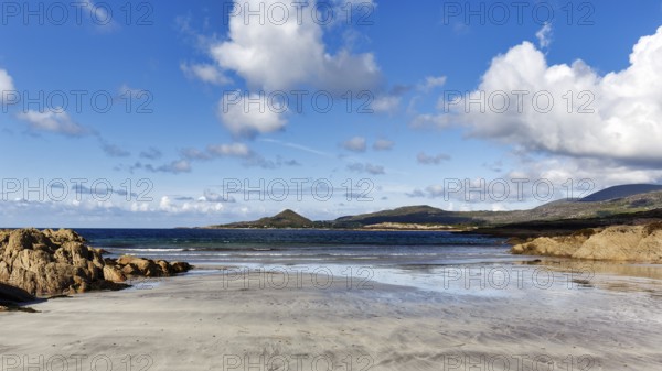 Sandy beach beach, rocky coast in bay at low tide, White Strand, Castlecove, panoramic road Ring of