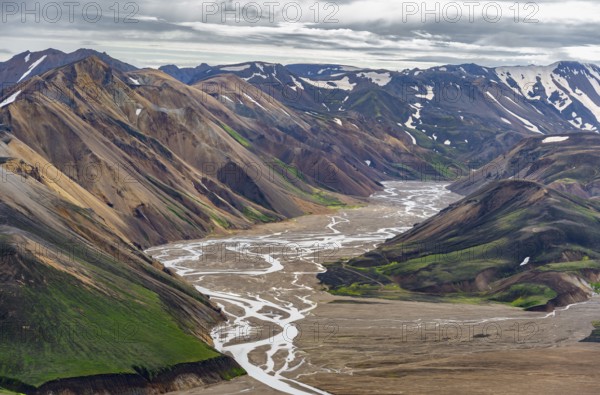 River between colourful rhyolite mountains, volcanic landscape, colourful erosion landscape, view
