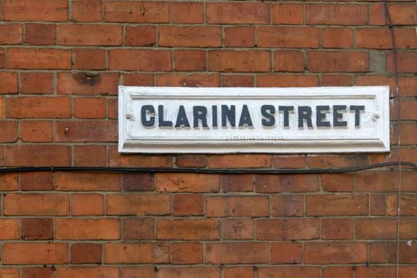 Victorian red brick terraced housing, street sign Clarina Street, inner city of Lincoln,