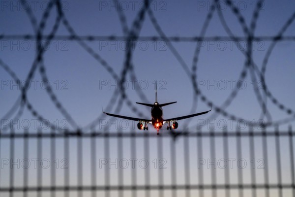 Symbolic image security at the airport, outer fence at Düsseldorf International Airport, steel wire