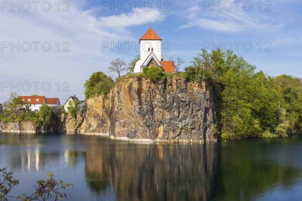 Mountain church on the Kirchberg, surrounded by the Kirchbruch quarry lake, striking view of