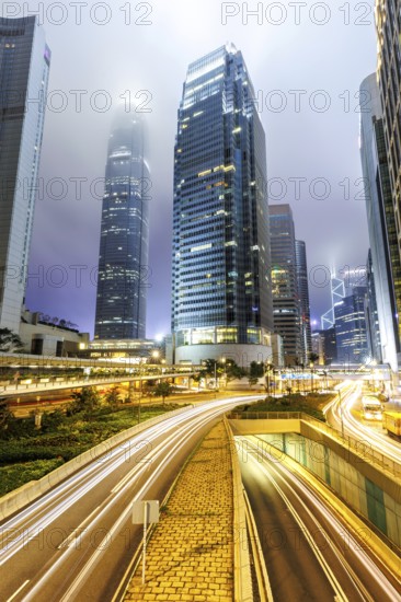 Hong Kong at night traffic with streets and skyscrapers in Hong Kong, China, Asia