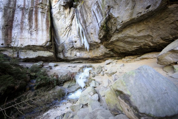 Frozen waterfall with icicles in the Gautschgrotte, Hohnstein, Saxony, Germany, Europe