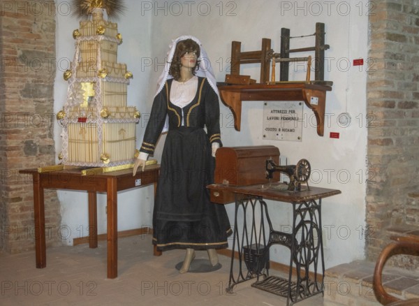 Interior with folk costume in museum in Aliano, the very poor village in southern Italy that the