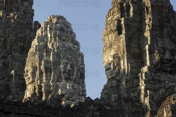 Panoramic image of giant stone-carved faces of the Bodhisattva Lokeshvara, also known as