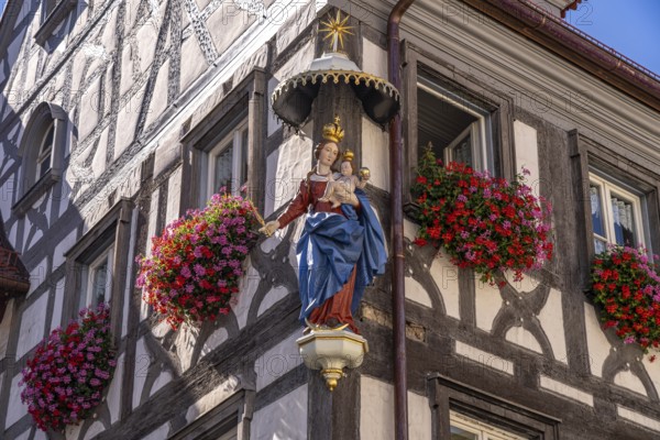 Madonna with child and floral decoration on a half-timbered house in Forchheim, Upper Franconia,
