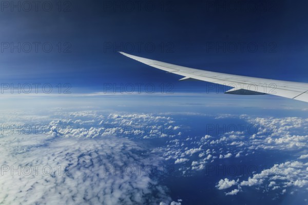 Above the clouds over the Indian Ocean, Bay of Bengal. View from the aircraft window during a