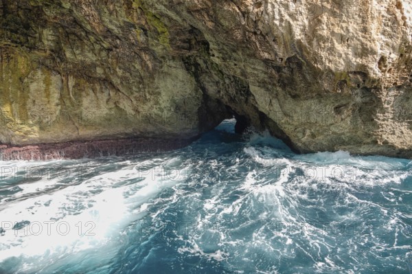 Rugged coastal landscape with rocky cave and wild sea waves, Maria di Leuca, Apulia, Italy, Europe