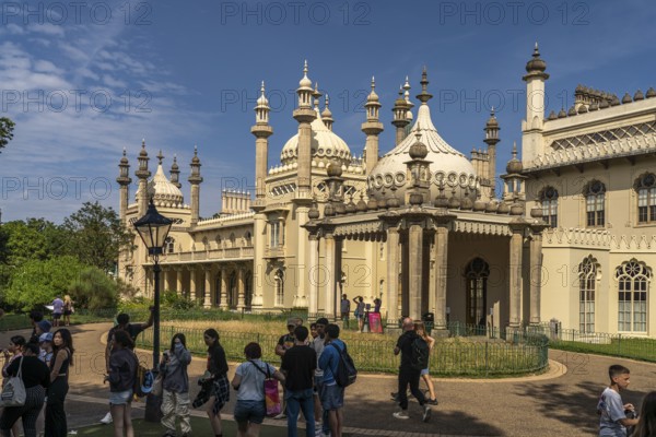 Students in front of the Royal Pavilion in the seaside resort of Brighton, England, Great Britain