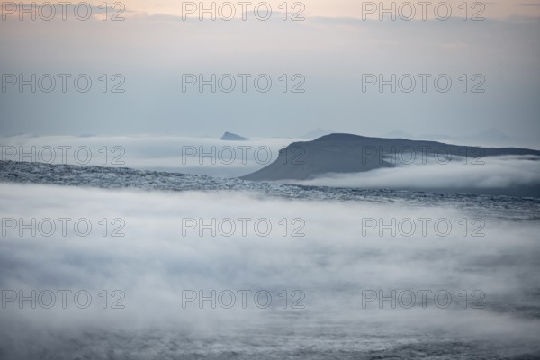 Fog over the glacier ice of Myrdalsjökull glacier, at sunset, Pakgil, Iceland, Europe