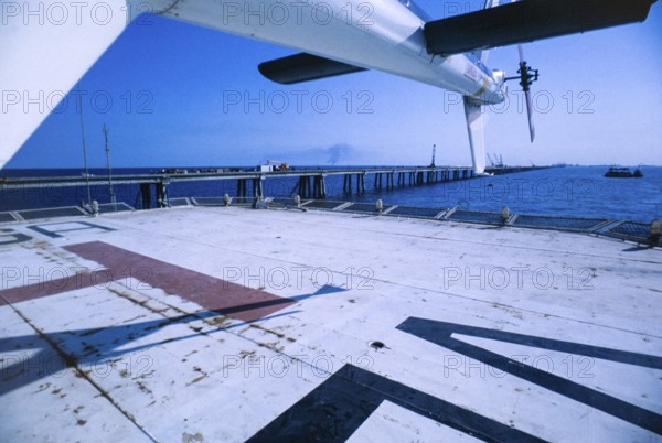 Oil industry in Ras Tanura area, Saudi Arabia, helicopter pad on offshore pier 1979, Asia