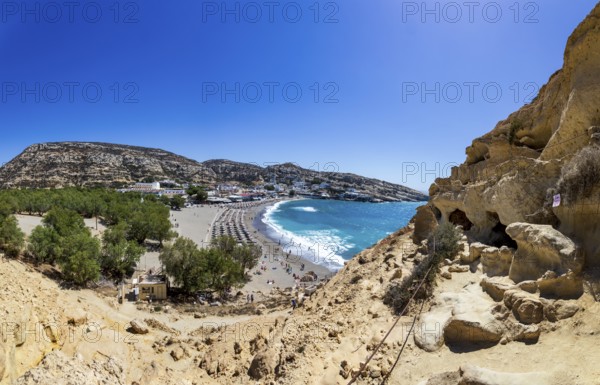View from the rock caves to the beach of Matala, south coast, Crete, Greece, Europe