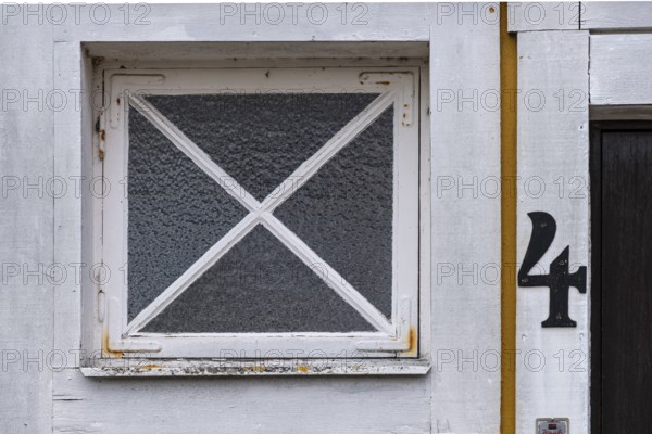 The number 4 on a front door next to a window, Karlskrona, Blekinge län, Sweden, Europe