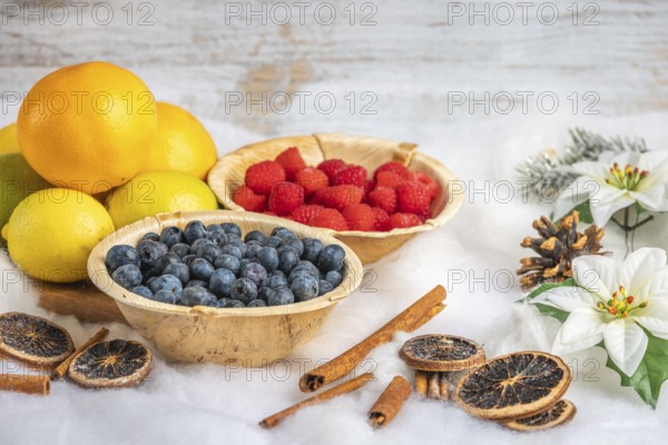 Healthy fruit and berries, white background, Christmassy decoration