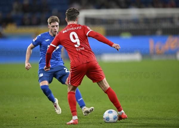 tackle, action Alexander Prass TSG 1899 Hoffenheim (22) against Lucas Höler SC Freiburg SCF (09)