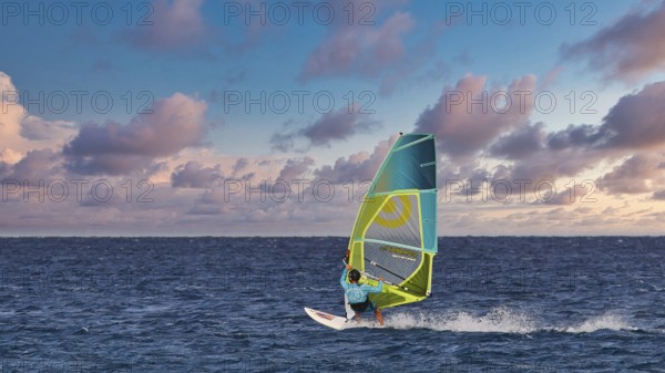Sky exchanged, windsurfer gliding across the sea under a dramatic sky, windsurfer, Meltemi