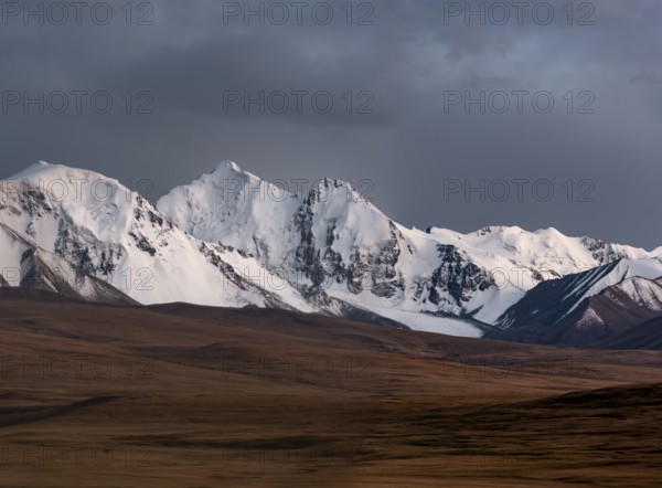 Glaciated and snow-capped mountains, dramatic landscape, high plateau, autumnal mountain landscape
