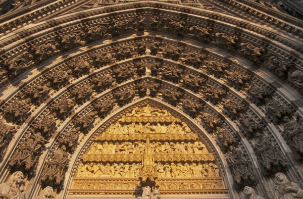 Main portal of the west façade of Cologne Cathedral with statue of the Virgin Mary, baby Jesus and