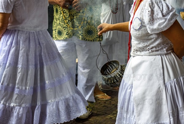 Smoking with burning herbs for spiritual cleansing of people and the common place in Umbanda and