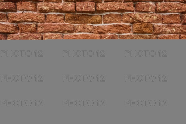 Detail of an old ziggurat wall made of bakestone bricks, Venice Italy
