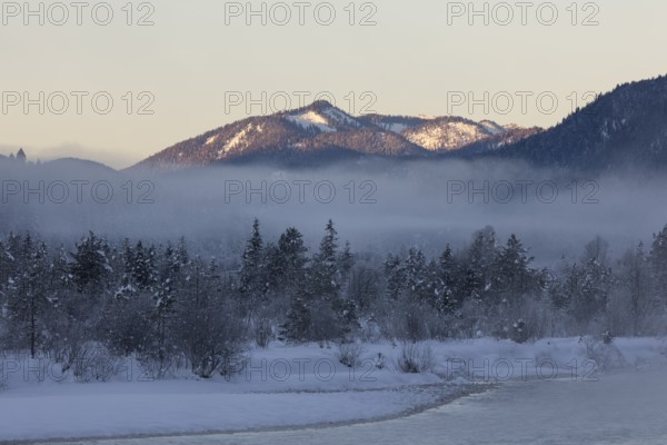 Isar valley in winter at temperatures of minus 18 degrees Celsius. Snow covered landscape with the