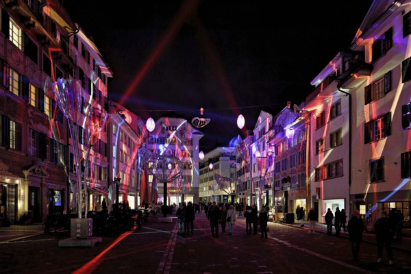 Light installation, on building facades and sculptures in the form of glasses and butterflies in