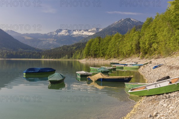Boats at the beach. Early morning at the Sylvenstein reservoir, Reservoir in the Isarwinkel,