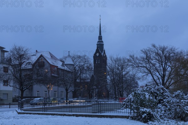 Slightly snow-covered Wettinplatz with tower of the New Church, Coswig, Saxony, Germany, Europe
