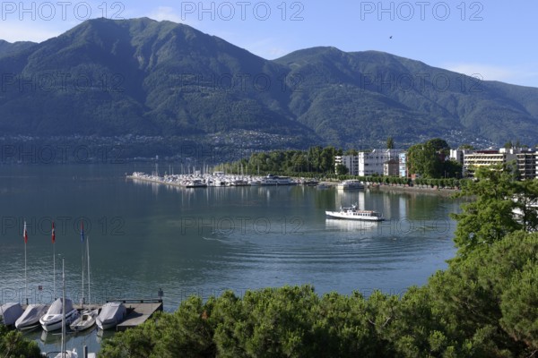 View of Lake Maggiore with marina and town, Locarno, Canton Ticino, Switzerland, Europe