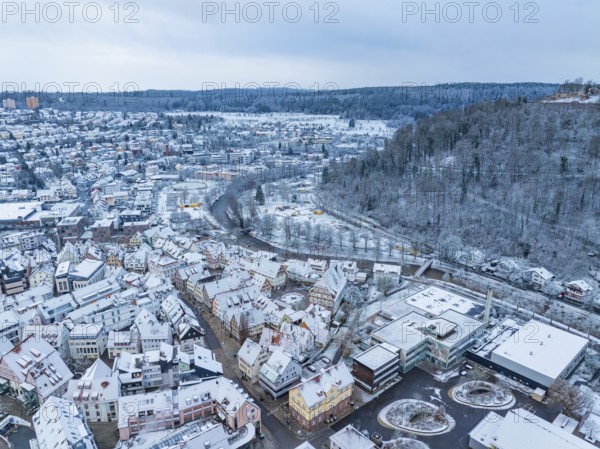Winter city view with river, viaduct and snow-covered hills, Nagold, Black Forest, Germany, Europe
