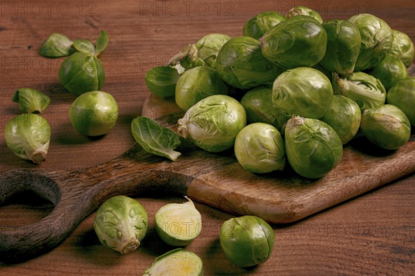 Fresh Brussels sprouts, raw, top view, on a wooden table, no people