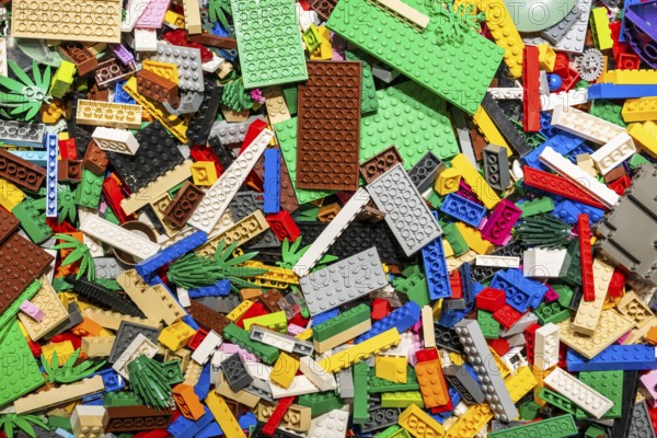 Different coloured Lego bricks and Lego plates, chaotically distributed, Copenhagen, Denmark,