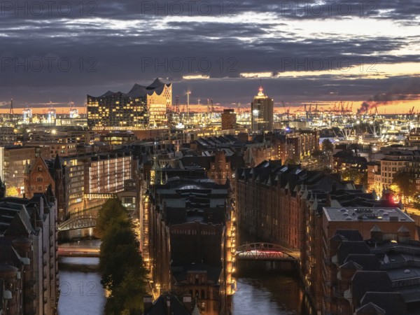 Aerial view of Hamburg warehouse district with Elbe Philharmonic Hall concert hall at sunset,