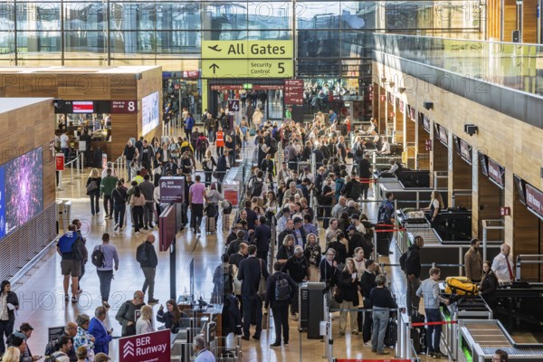 Berlin-Brandenburg BER Airport. Passengers in Terminal 1 waiting for check-in and security control