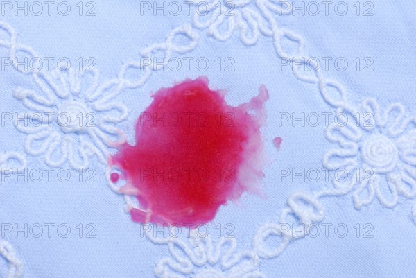 Stains of candle wax on fabric, tablecloth