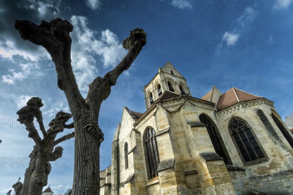 Auvers-sur-Oise. Notre-Dame-de-l'Assomption church painted by Vincent Van Gogh. Val-d'Oise