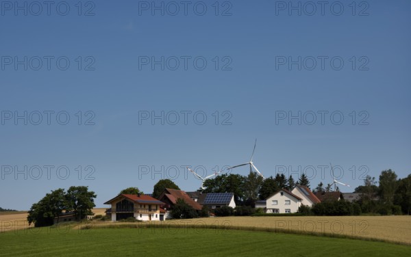 Wind turbines, solar cells on house roof, wheat field, Barholomä, Swabian Alb, Baden-Württemberg,