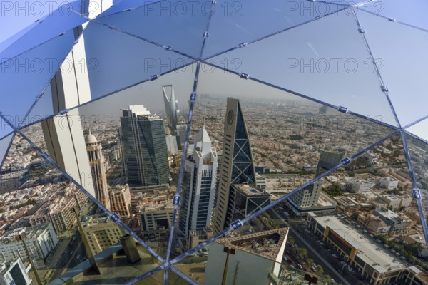 Reflection of the skyline in the glass sphere of Al Faisaliah Tower, Riyadh, Saudi Arabia, Asia