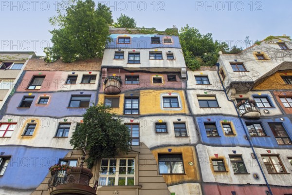 Colorful Facade of Hundertwasserhaus, apartment house designed by Friedensreich Hundertwasser in