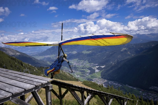 Hang glider takes off from ramp, Panorama Restaurant Kreuzjoch, Schlick 2000, Fulpmes, Stubai