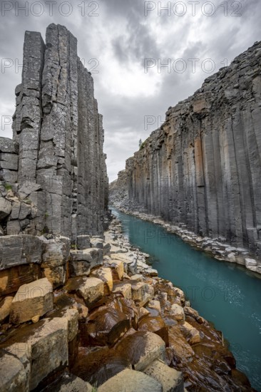 Stuðlagil Canyon, turquoise river between basalt columns, Egilsstadir, Iceland, Europe