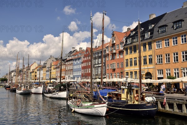 Sailing boats on the canal in front of colorful facades, Nyhavn, Copenhagen, Denmark, Europe