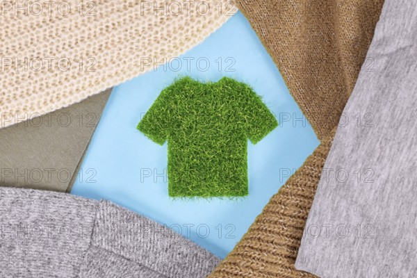 Concept for environmental friendly produced clothing with shirt made out of grass surrounded by