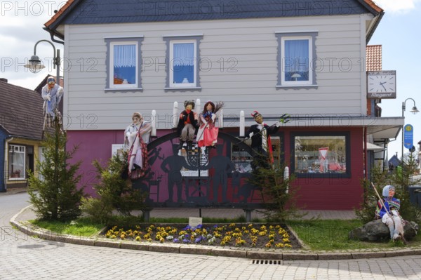 Figures of witches in front of a residential house, Walpurgis Night, St. Andreasberg, Lower Saxony,