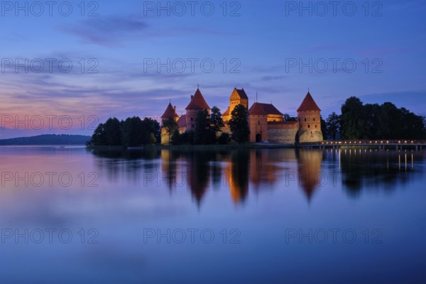 Trakai Island Castle in lake Galve illuminated in night, Lithuania, Europe